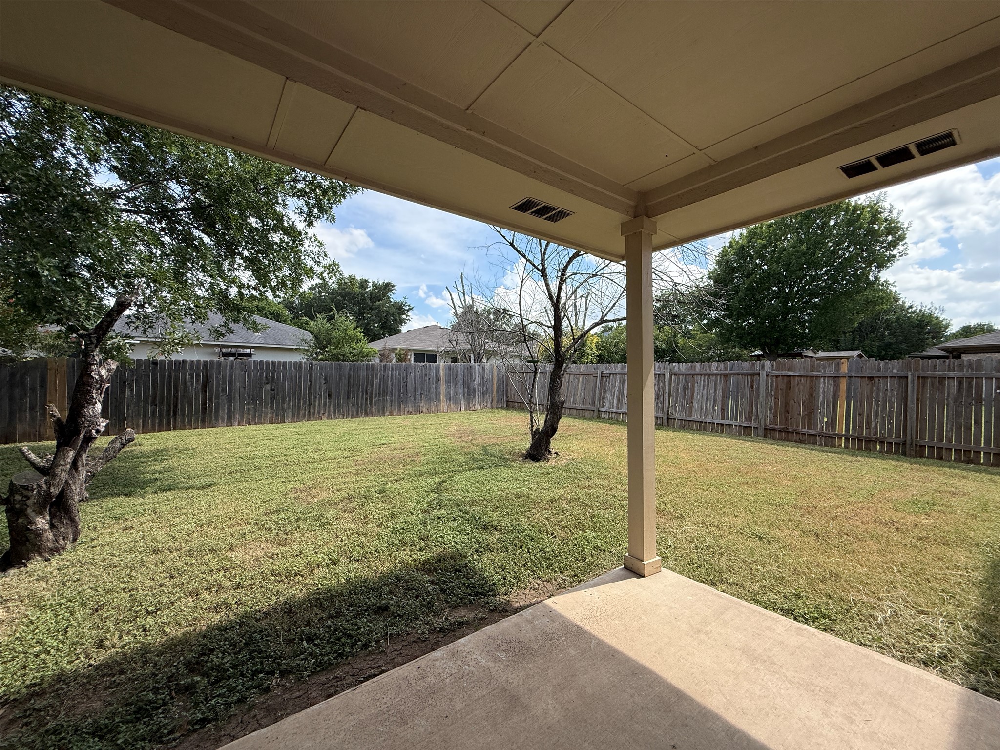 2120 Jester Farms Road Round Rock, TX 78664 - Photo 24 of 28 A spacious backyard with a private wooden fence, ready for personalized outdoor living.