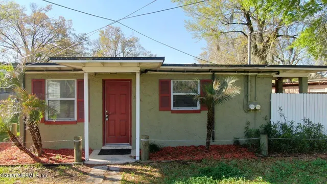 a view of a house with a tree