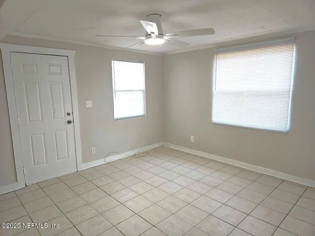 a view of an empty room with a window