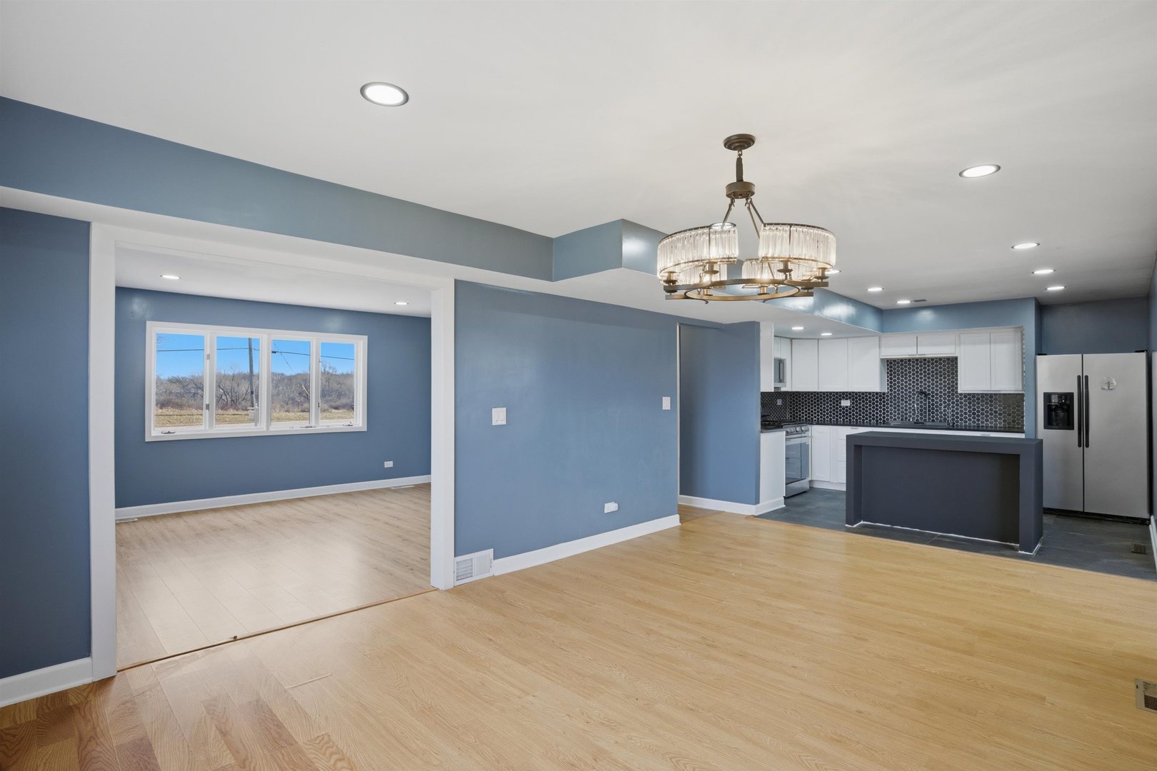 17N620 Ketchum Road Hampshire, IL 60140 - Photo 15 of 50 a view of a kitchen with granite countertop stainless steel appliances and a chandelier