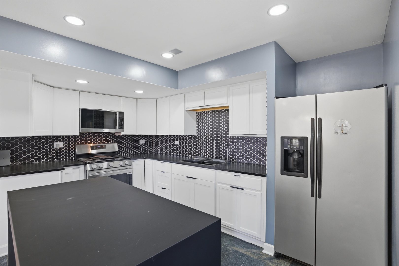 17N620 Ketchum Road Hampshire, IL 60140 - Photo 16 of 50 a kitchen with stainless steel appliances a refrigerator and a stove top oven