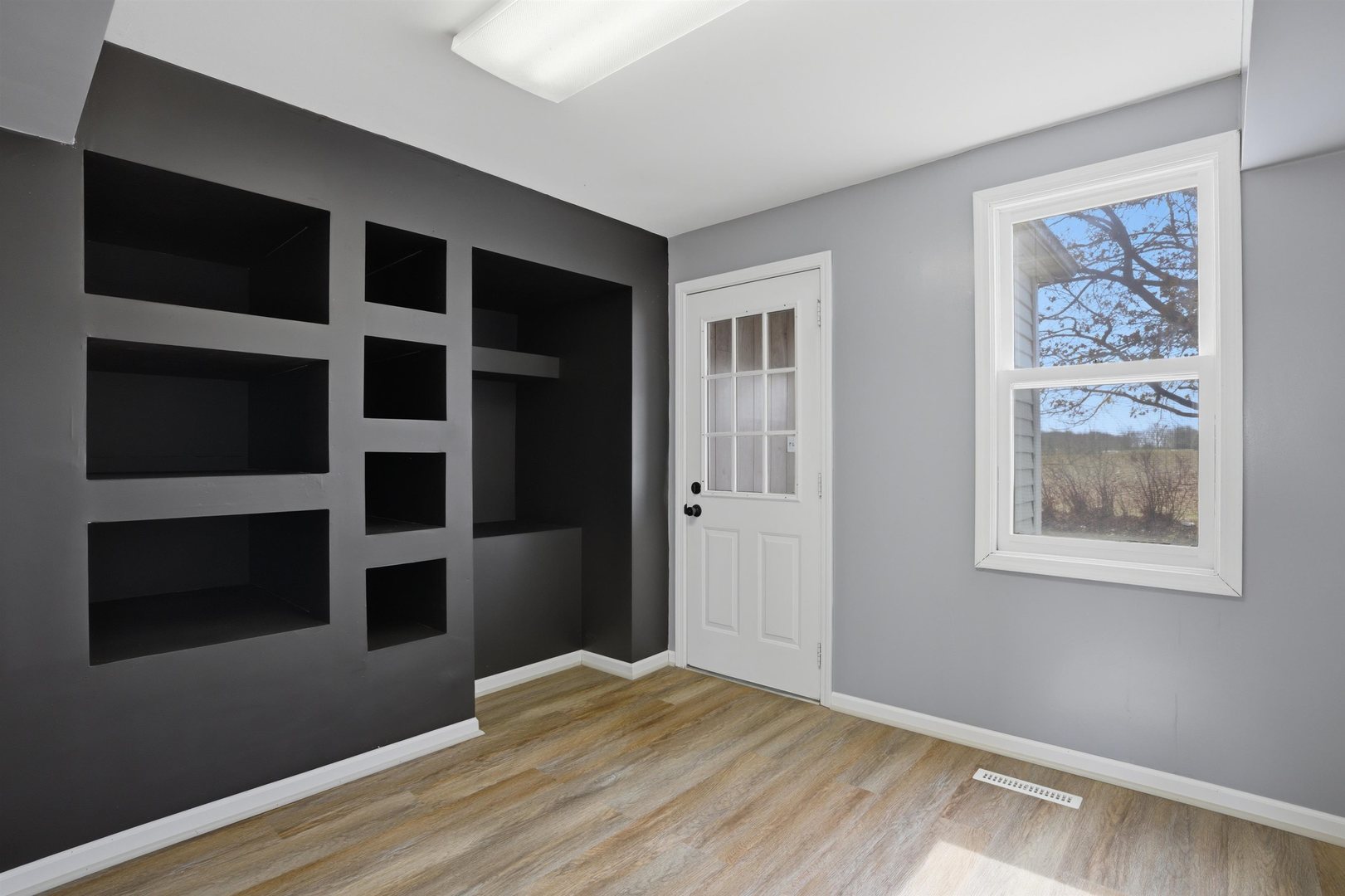 17N620 Ketchum Road Hampshire, IL 60140 - Photo 10 of 50 a view of an empty room with a fireplace and a window