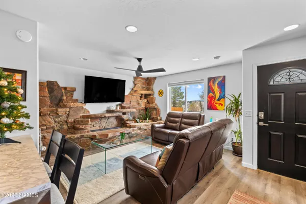 a living room with furniture and a flat screen tv
