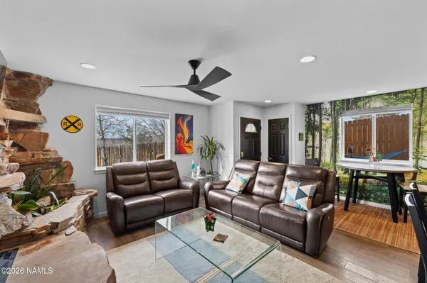 a view of a livingroom with furniture and window