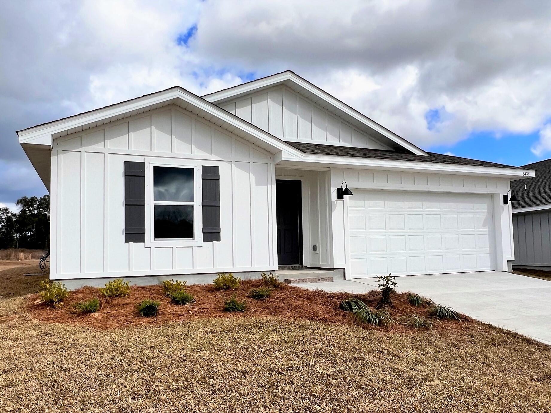 3413 Phoenix Court Crestview, FL 32539 - Photo 2 of 31 a front view of a house with a yard