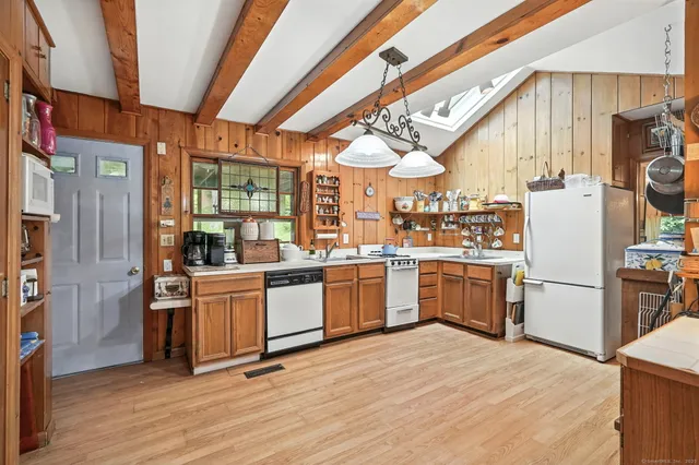 a kitchen with sink cabinets and stainless steel appliances
