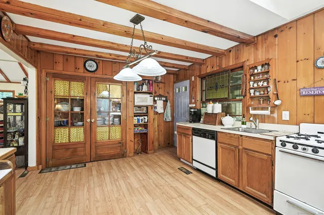 a kitchen with stainless steel appliances granite countertop a sink and cabinets