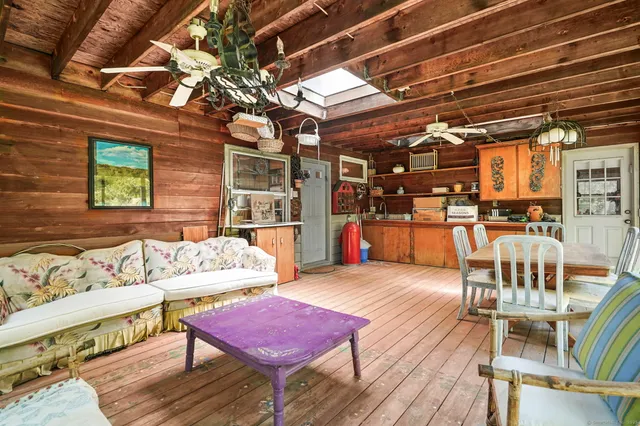 a outdoor living space with furniture and a wooden floor