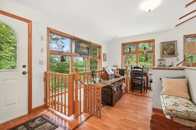 a view of a livingroom with furniture window and outside view
