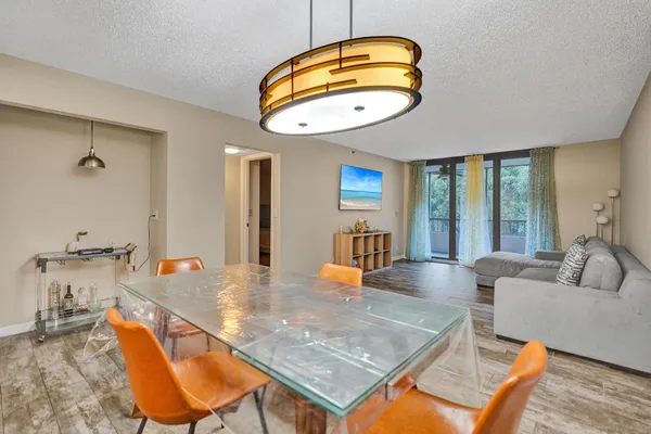 a kitchen with a table and chairs