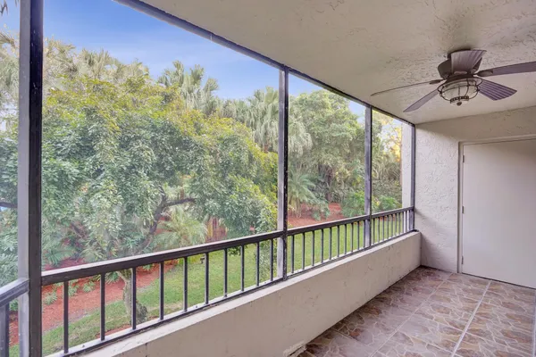 a view of a balcony with furniture