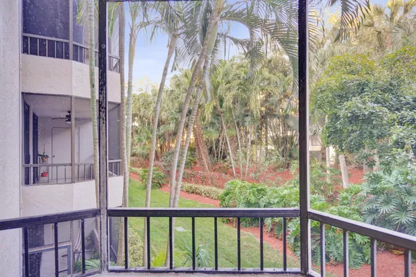 a view of a balcony with a tree