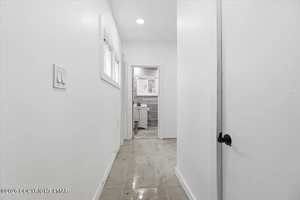 a view of a storage & utility room with a window