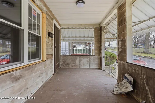 a view of an entryway with a floor to ceiling window