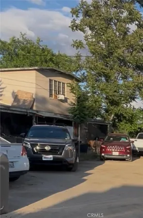 a view of a car parked in front of a house