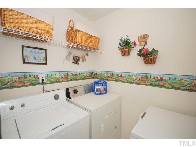 4105 Mantua Way Raleigh, NC 27604 - Photo 13 of 25 a bathroom with a sink a vanity and a mirror