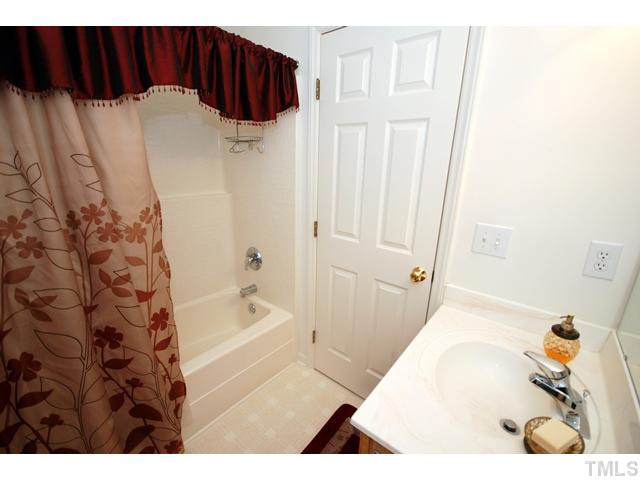 4105 Mantua Way Raleigh, NC 27604 - Photo 17 of 25 a bathroom with a bathtub and a shower