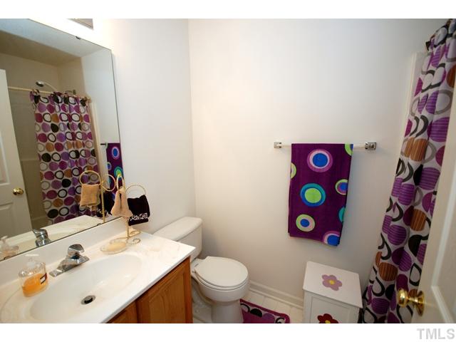 4105 Mantua Way Raleigh, NC 27604 - Photo 19 of 25 a bathroom with a sink toilet and vanity