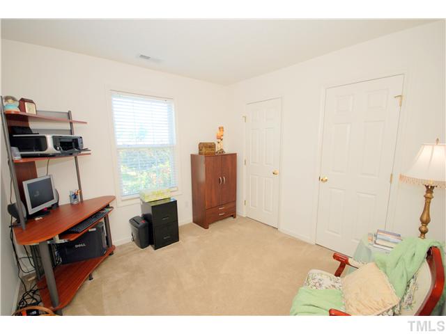 4105 Mantua Way Raleigh, NC 27604 - Photo 20 of 25 a bedroom with a bed and furniture