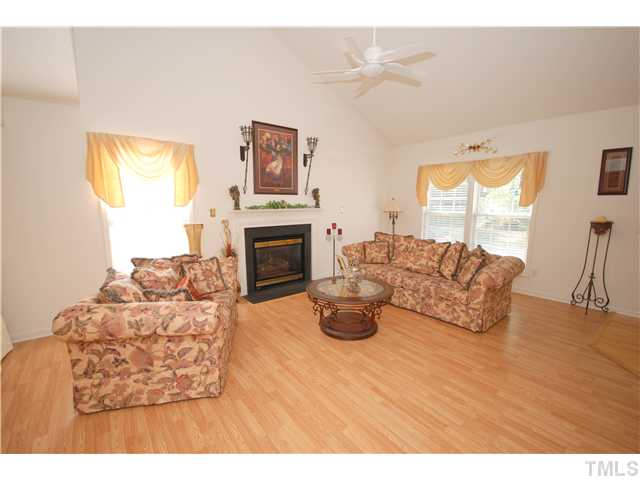 4105 Mantua Way Raleigh, NC 27604 - Photo 3 of 25 a living room with furniture and a fireplace