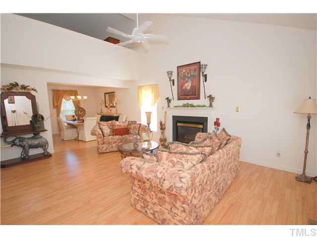 4105 Mantua Way Raleigh, NC 27604 - Photo 4 of 25 a living room with furniture and a fireplace