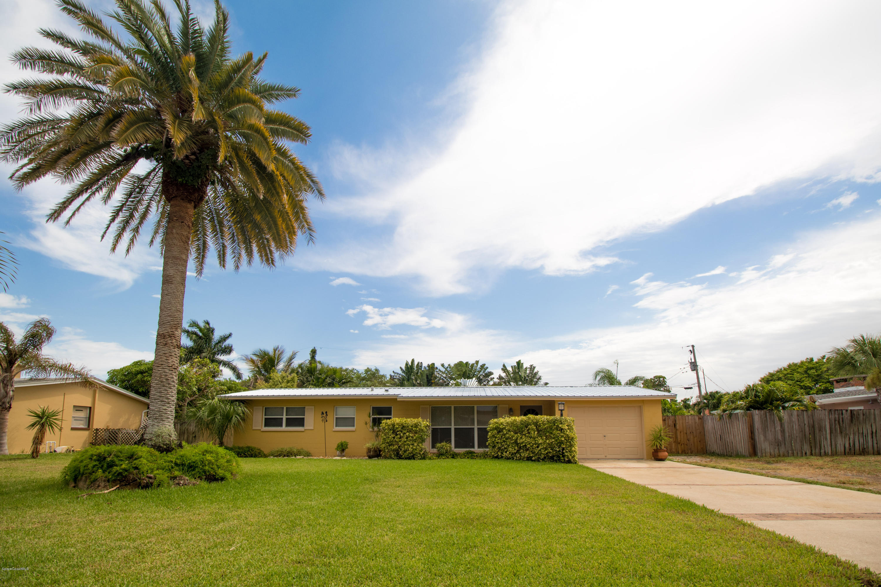 1054 Bali Road Cocoa Beach, FL 32931 - Photo 1 of 24 a view of house with outdoor space and swimming pool