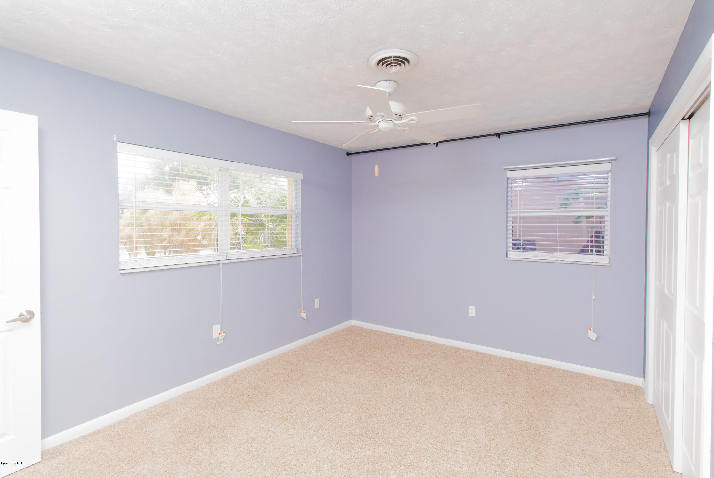 1054 Bali Road Cocoa Beach, FL 32931 - Photo 17 of 24 a view of an empty room with a window