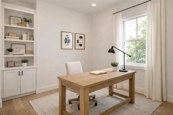 a view of a workspace with furniture