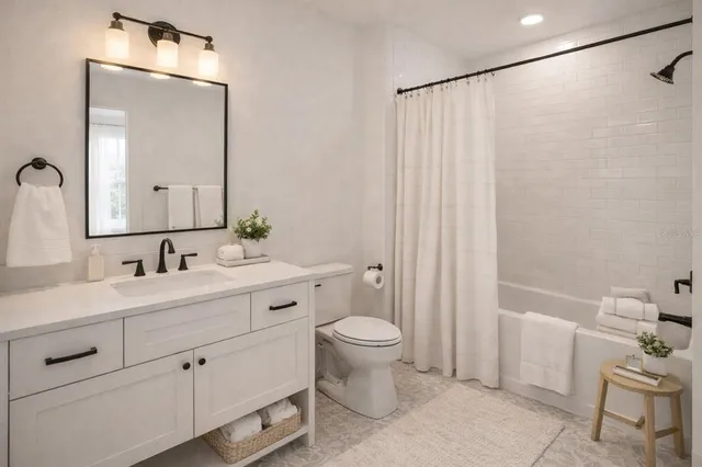 a bathroom with a double vanity sink mirror and toilet