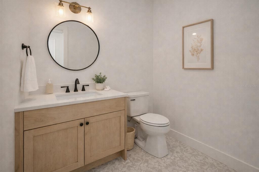 1630 Murphy Street Oviedo, FL 32765 - Photo 17 of 22 a bathroom with a toilet a sink and a mirror