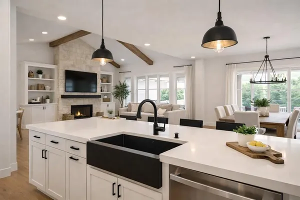 a kitchen with a sink a microwave and cabinets