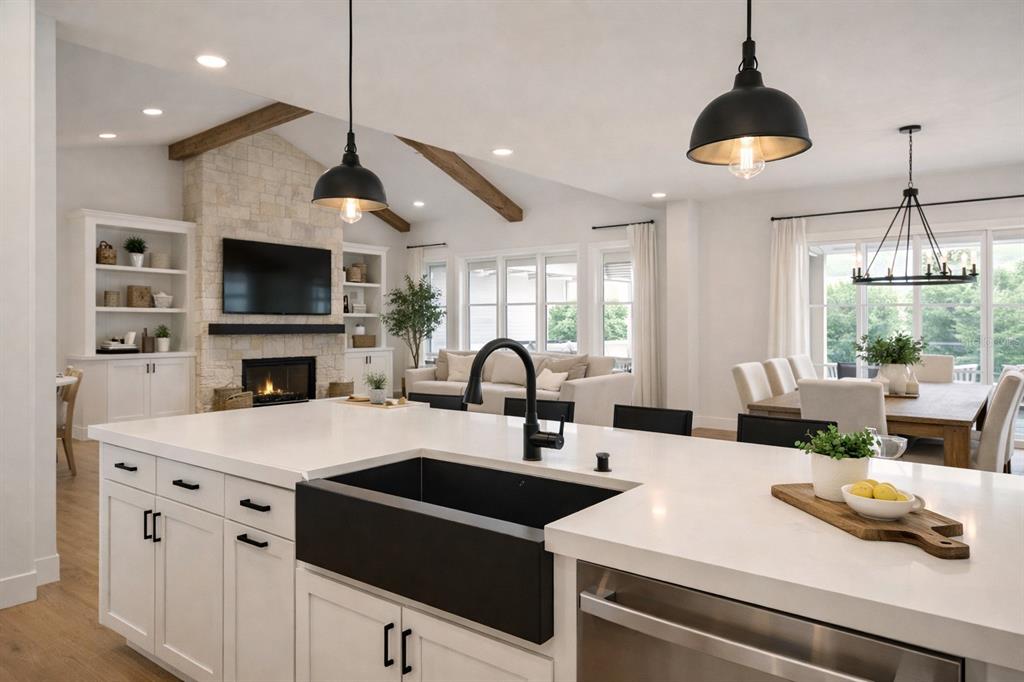 1630 Murphy Street Oviedo, FL 32765 - Photo 5 of 22 a kitchen with a sink a microwave and cabinets