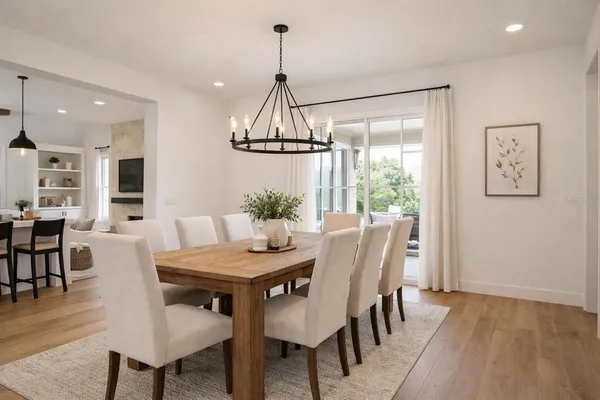 a view of a dining room with furniture window and wooden floor