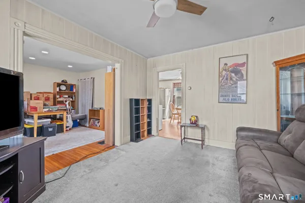 a living room with furniture and a large window