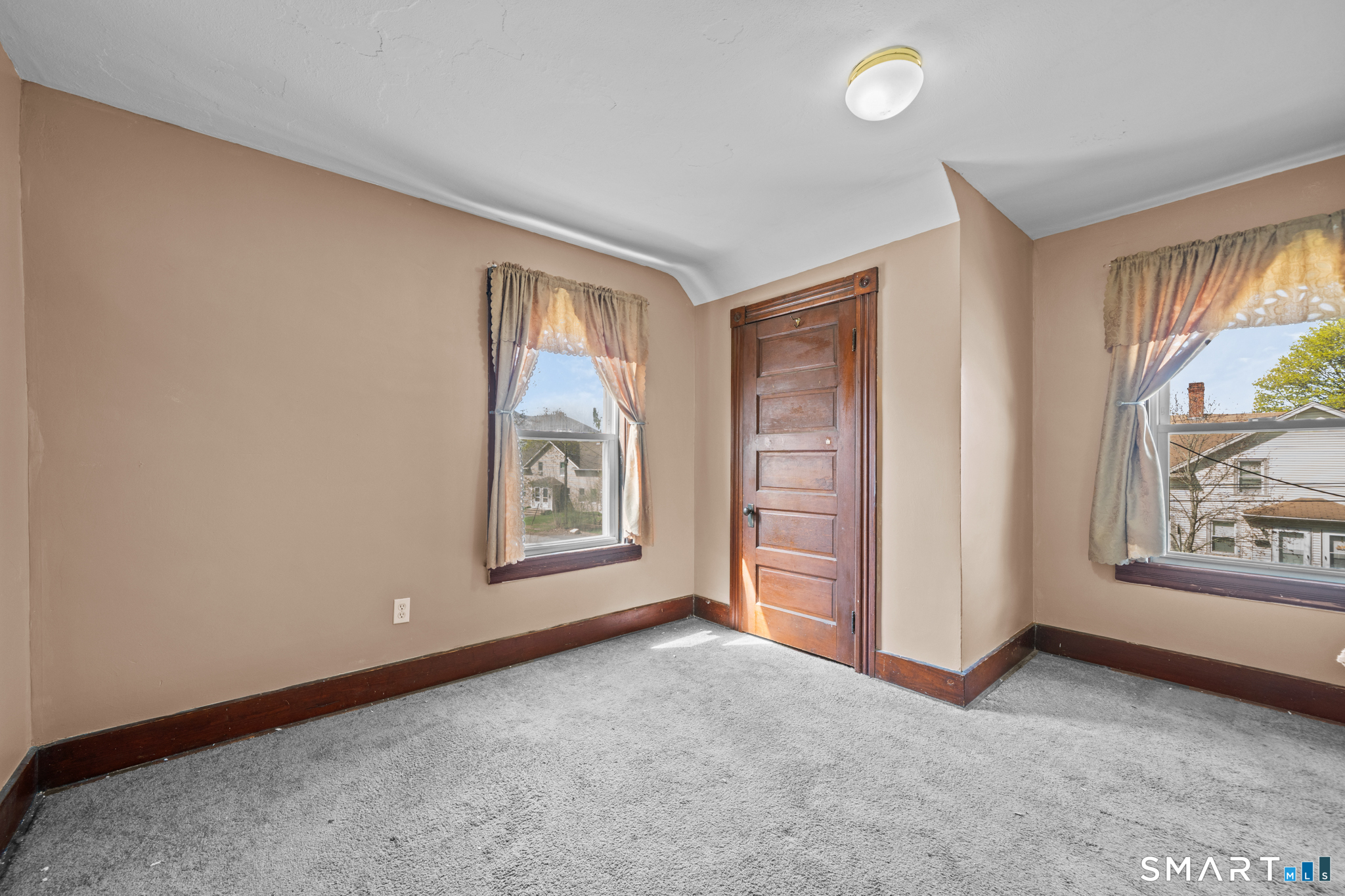 5 8th Street Plainfield, CT 06374 - Photo 14 of 40 an empty room with windows and closet