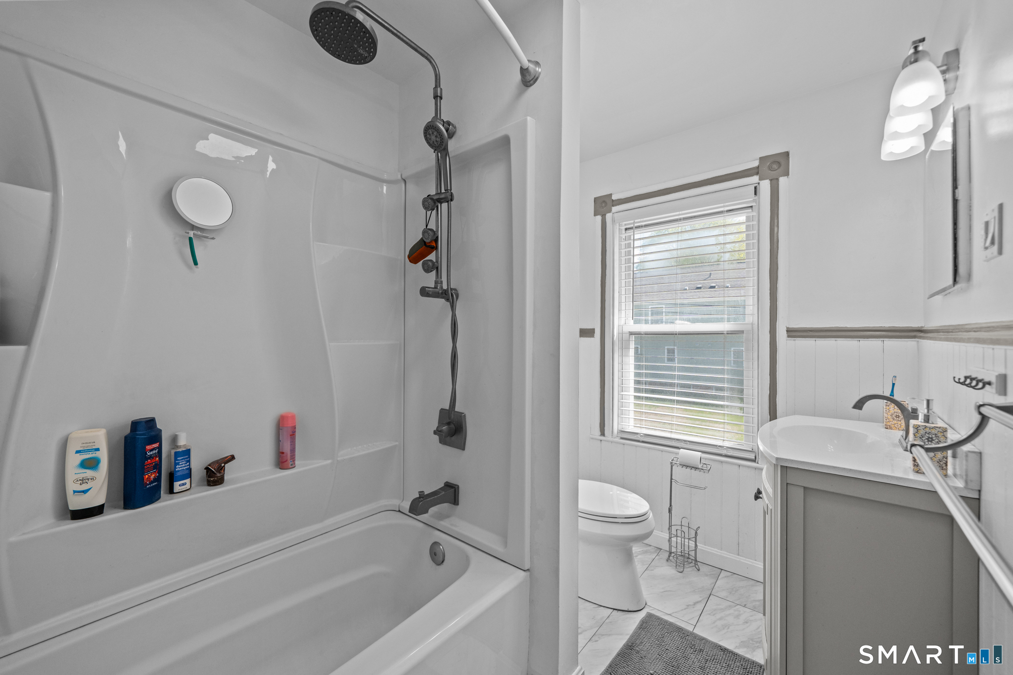 5 8th Street Plainfield, CT 06374 - Photo 19 of 40 a bathroom with a granite countertop sink a toilet and shower