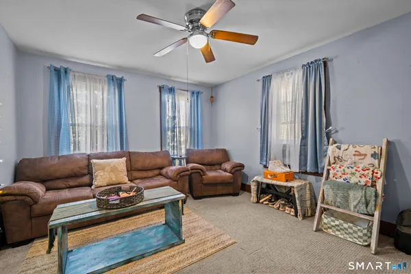 a living room with furniture and a window