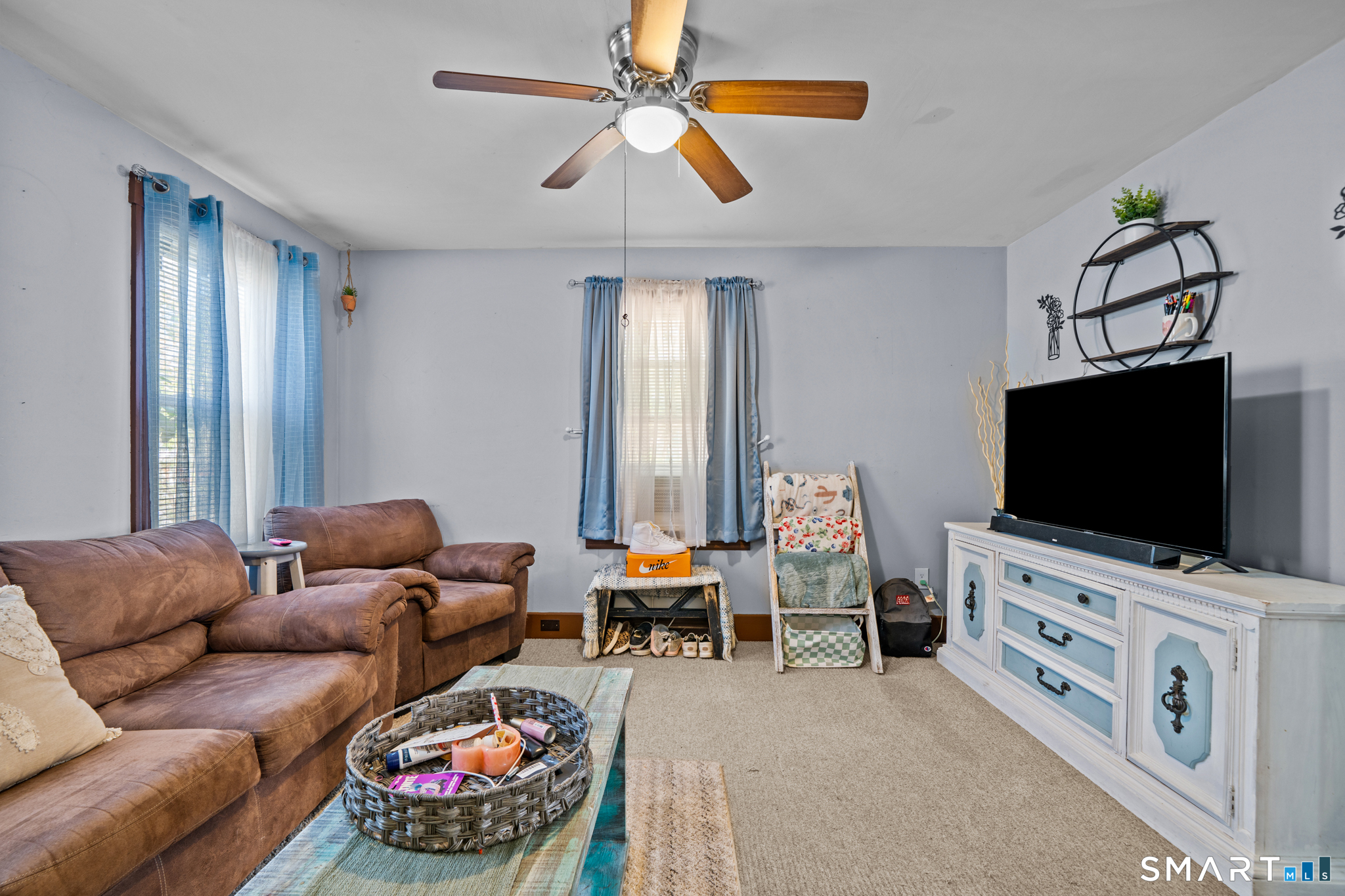 5 8th Street Plainfield, CT 06374 - Photo 25 of 40 a living room with furniture and a flat screen tv