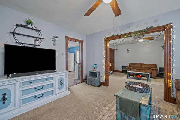 a living room with furniture and a flat screen tv
