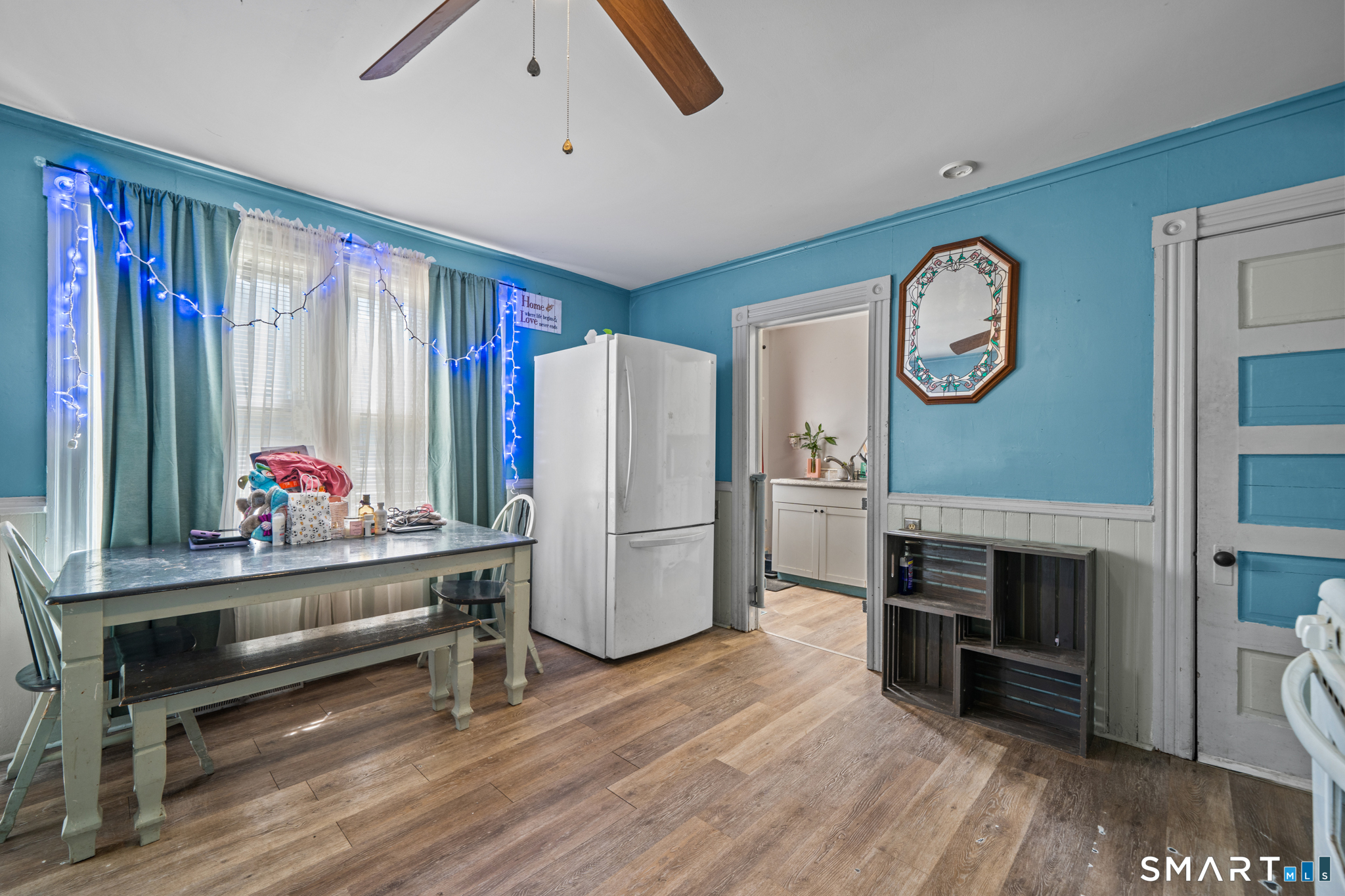 5 8th Street Plainfield, CT 06374 - Photo 29 of 40 a living room with furniture a fireplace and a flat screen tv
