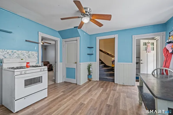 a kitchen with a stove a refrigerator and a sink