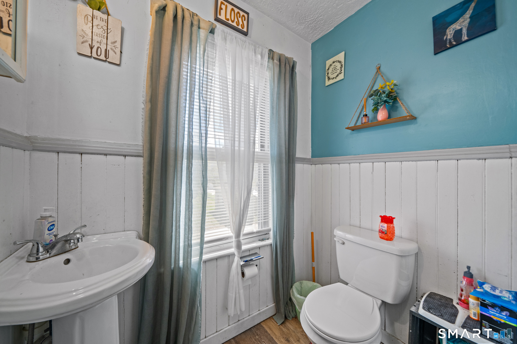 5 8th Street Plainfield, CT 06374 - Photo 34 of 40 a white toilet sitting next to a bathroom sink