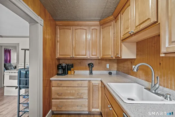 a kitchen with stainless steel appliances a sink and cabinets