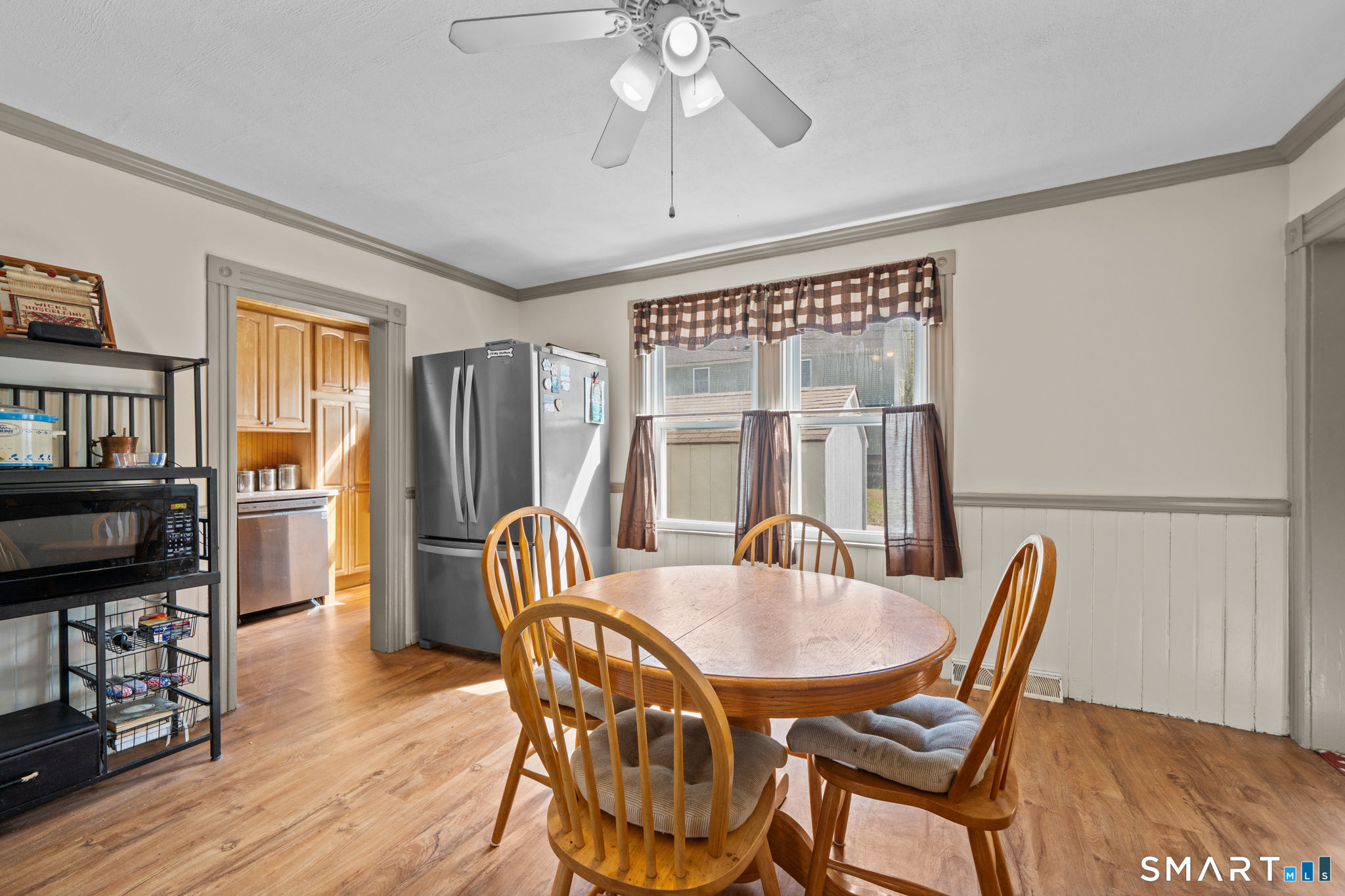 5 8th Street Plainfield, CT 06374 - Photo 5 of 40 a dining room with furniture a chandelier and wooden floor