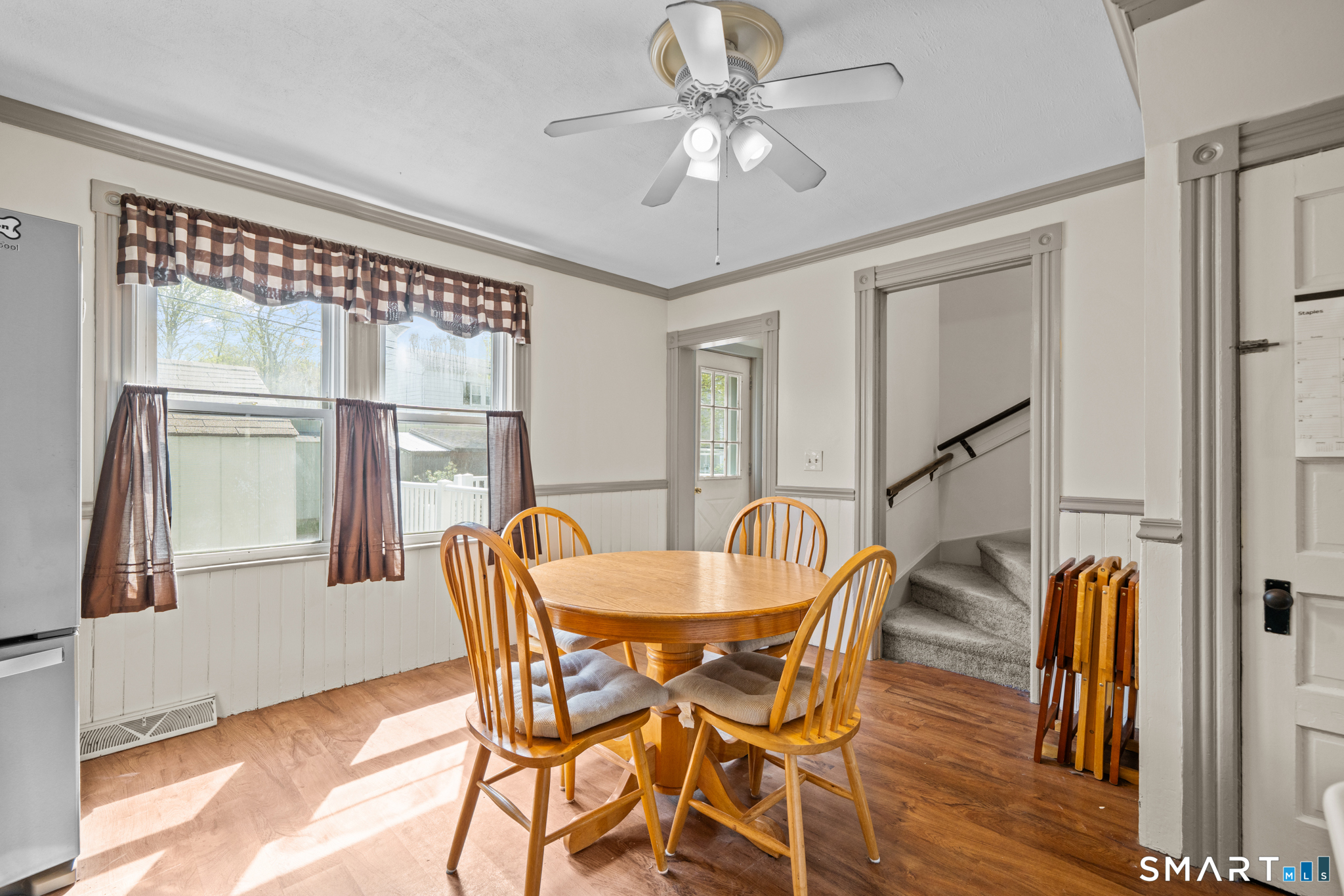 5 8th Street Plainfield, CT 06374 - Photo 6 of 40 a dining room with furniture a chandelier and wooden floor
