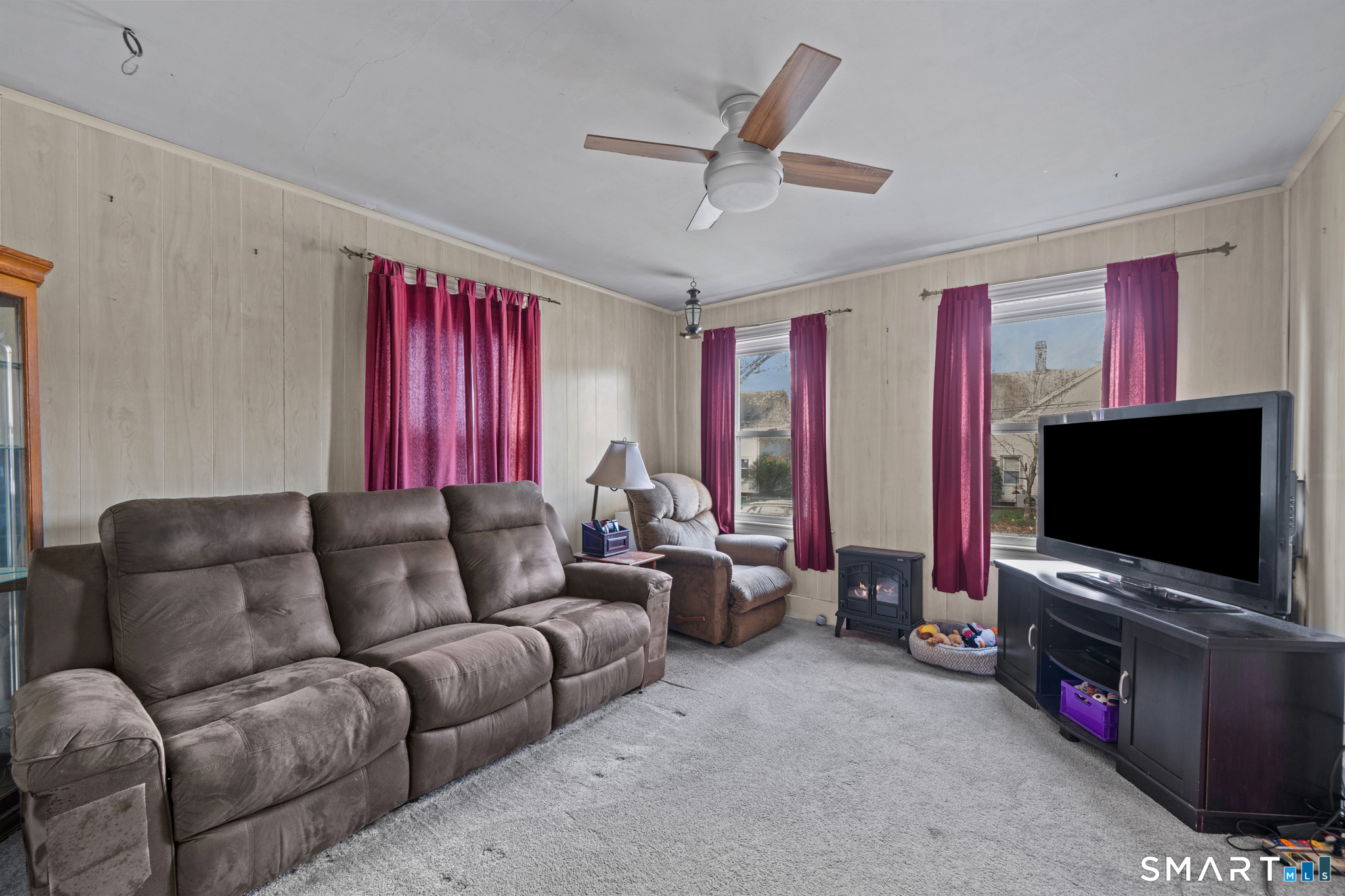5 8th Street Plainfield, CT 06374 - Photo 9 of 40 a living room with furniture and a flat screen tv