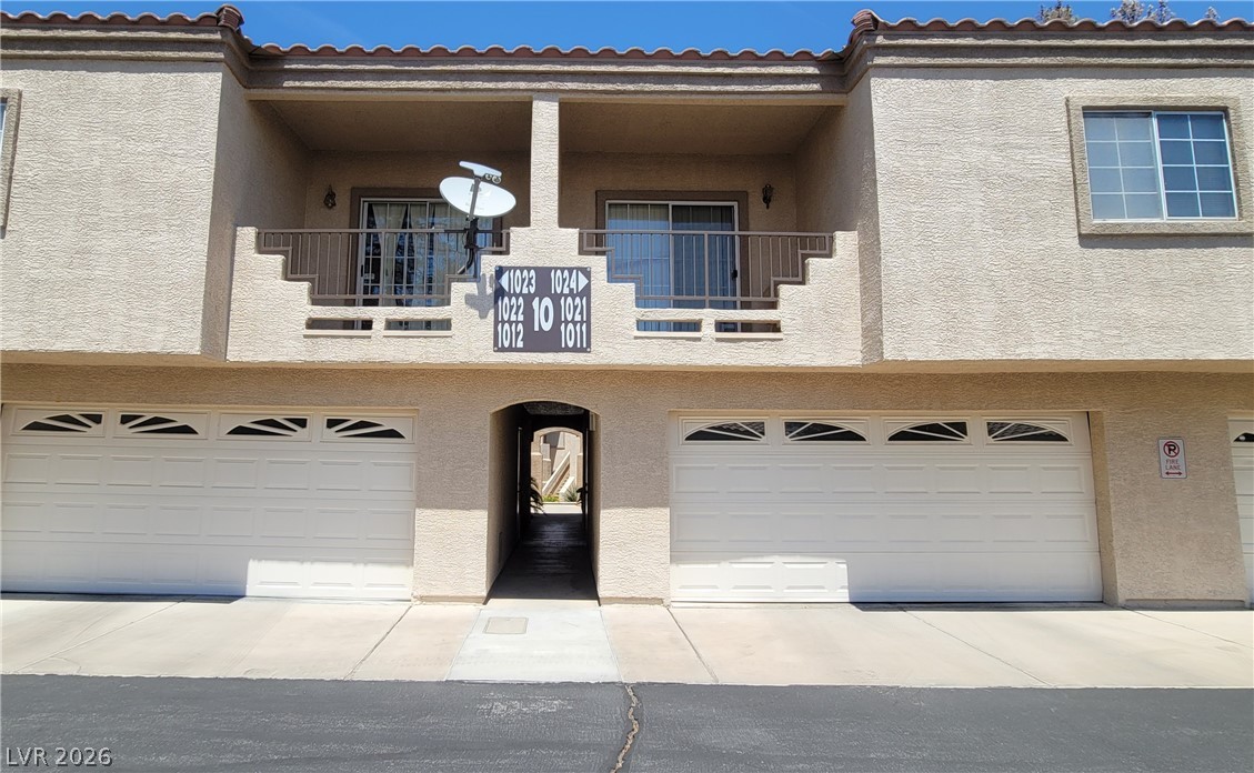1851 Hillpointe Road, Unit 1022 Henderson, NV 89074 - Photo 2 of 8 A classic two-story facade with twin garages and inviting balconies offers functional charm.