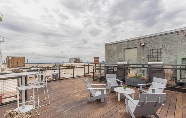 a view of a terrace with seating area and furniture
