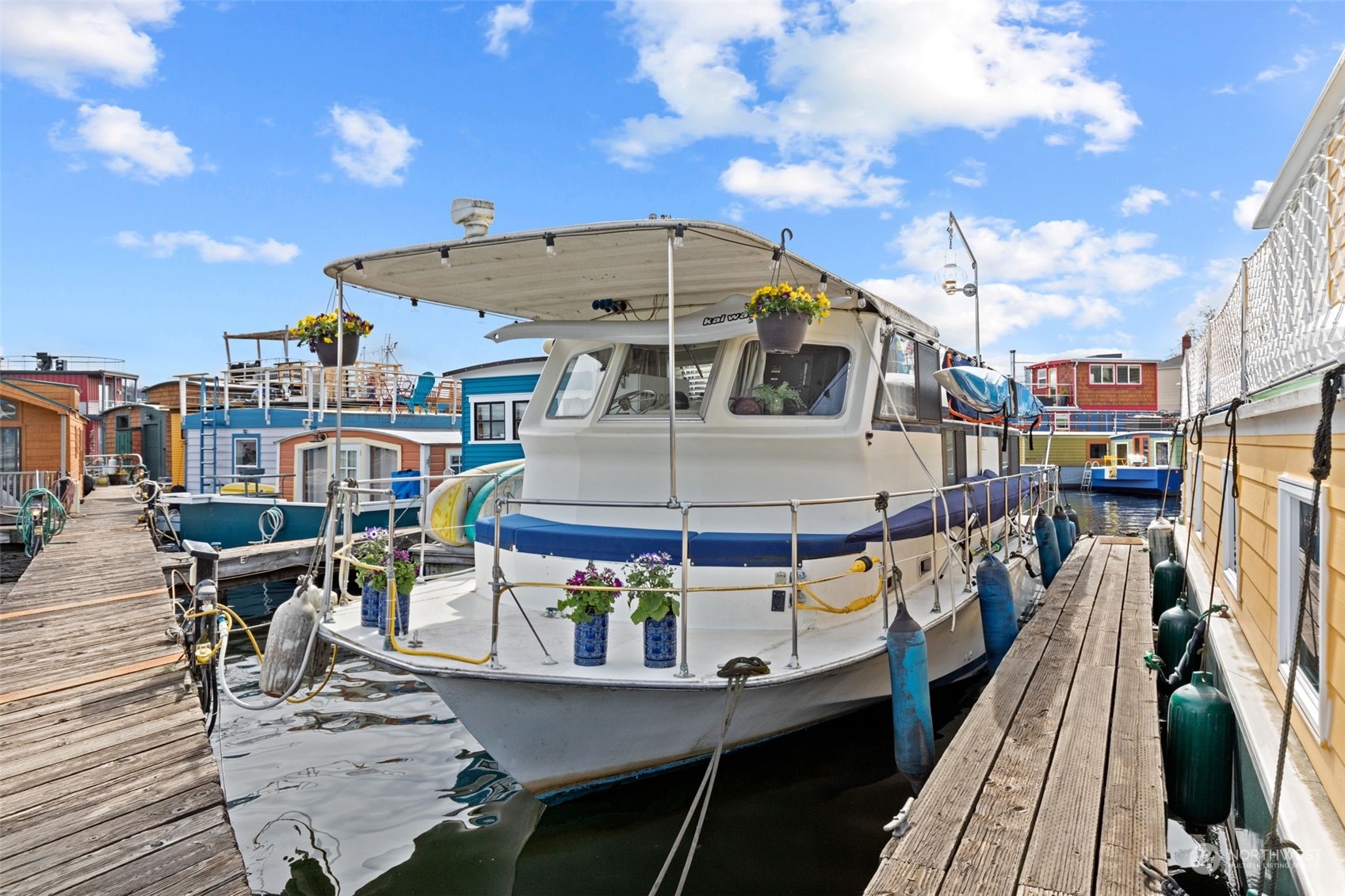 a roof deck with table and chairs