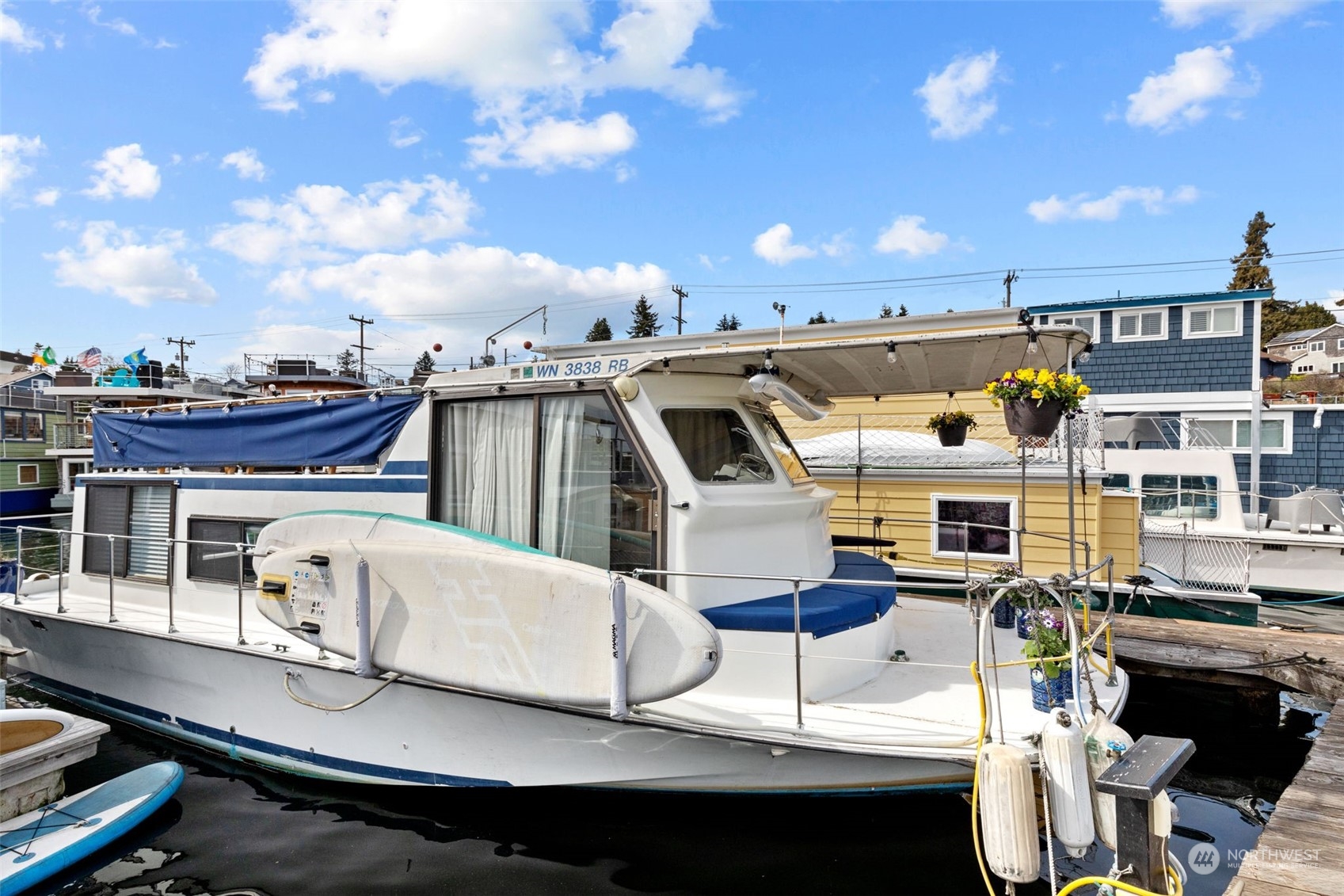 2401 North Northlake Way, Unit E6 Seattle, WA 98103 - Photo 16 of 25 a roof deck with table and chairs with wooden floor